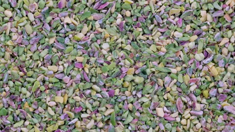 Top down view. Chopped, crushed, granulated green pistachios in heap. 動画素材 296570351