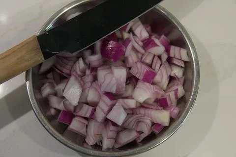 Top Down View of Chopped Red Onion with Chef Knife Stock Photos