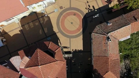 Top-down view of circular tile pattern in Chavdar village square Bulgaria Stock Footage 347912179