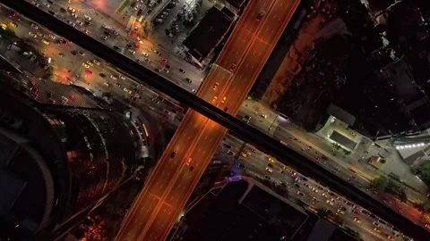 Top down view of city traffic flowing through nighttime Bangkok Thailand Stock-Footage 304694563