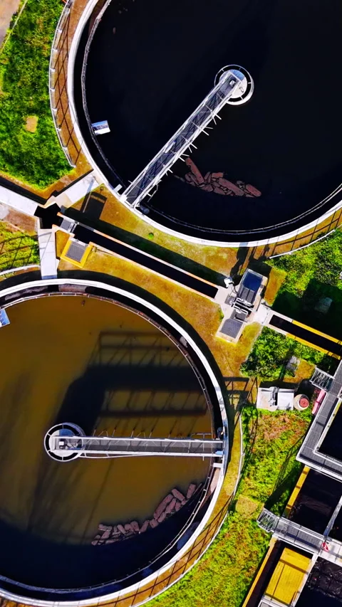 Top down view of clarifier tanks with rotating bridges, Burgas, Bulgaria Stock Footage 338007444