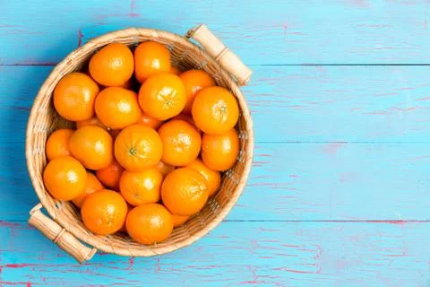 Top down view of clementines in basket Stock Photos