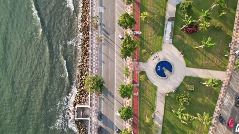 Top down view Coastal city with the main avenue and a public park near the sea. Stock Footage 246818845