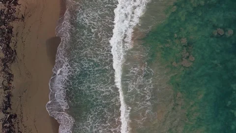 A top-down view of the coastline during a mild storm Stock Footage 305859610