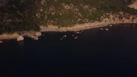 Top down view of coastline hill. Wild beach on the coast in a remote place 스톡 동영상 168097585