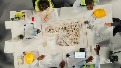 Top down view of colleagues in architecture working together Stock Photos