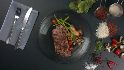 Top down view of cooked beef with asparagus. 4K Stock Footage 157843171
