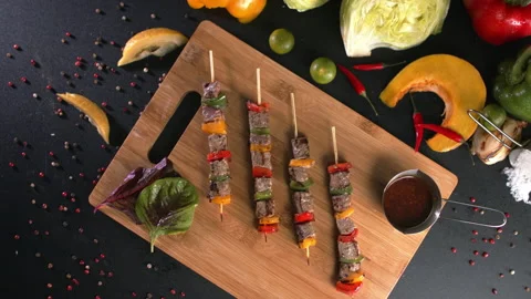 Top down view of cooked meat skewers Stock Footage 157843170
