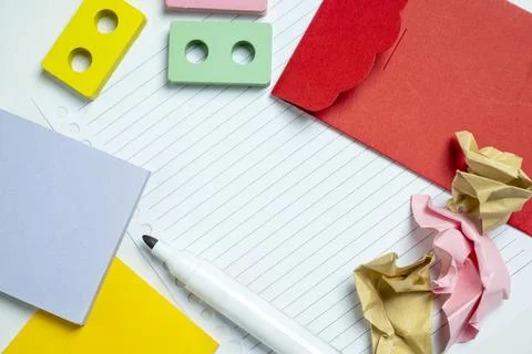 A top-down view of creative stationery including a white marker, sticky not.. Stock Photos