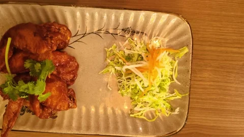 Top down view of crispy fried chicken with BBQ barbecue sauce, sliced carro.. Video stock 318129267