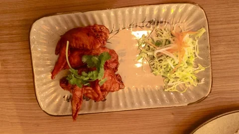 Top down view of crispy fried chicken with BBQ barbecue sauce, sliced carro.. 動画素材 318129317