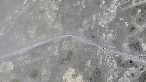 Top down view of crowded jeep cars on the Mount Bromo desert in East Java Stock Footage 329374103