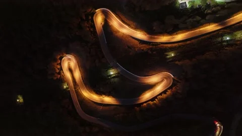 Top down view of a curly forest road in the night. Stock Footage 242948584