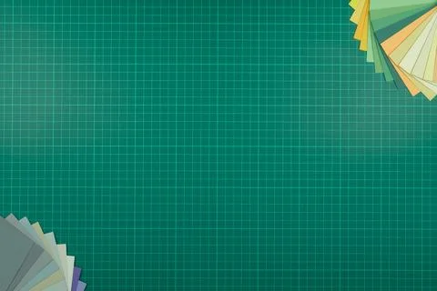 Top down view of cutting mat with colour swatches placed in opposite corners Stock Photos