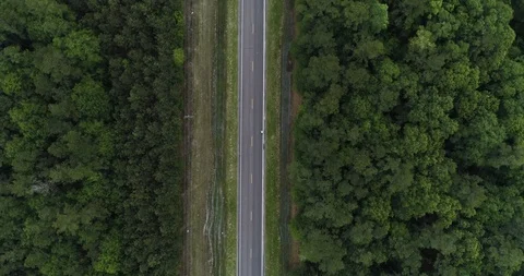 Top down view of cyclist riding in high visibility jacket drone aerial 4K Stock Footage 111363084