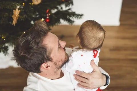 Top down view at dad, young man holding his baby girl Stock Photos