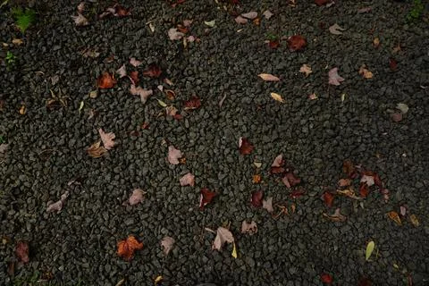 Top-down view of dark grey gravel surface scattered Fotos Stock