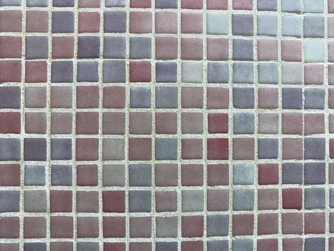 A top-down view of a decorative mosaic wall or floor featuring small square.. Stock Photos