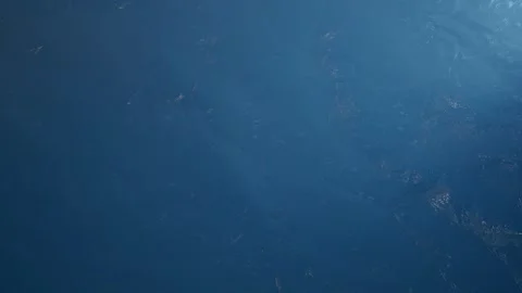 Top-Down View of Deep Blue Ocean Surface with Subtle Ripples for Background Stock Footage 345438974