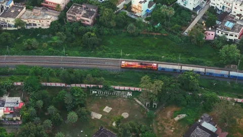 Top down view of The Delhi Rail running on the tracks towards the Station. Stock Footage 317821979