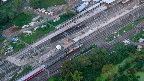 Top down view of The Delhi Rail running on the tracks towards the Station. Stock Footage 317939681