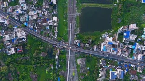 Top down view of The Delhi Rail running on the tracks towards the Station. Stock Footage 317940019