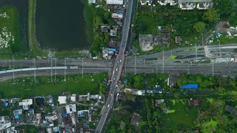 Top down view of The Delhi Rail running on the tracks towards the Station. Stock Footage 317940054
