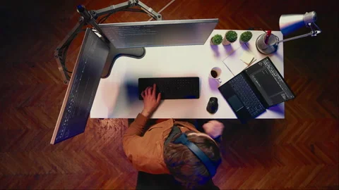 Top down view of developer typing complex code on laptop Stock Footage 265512563