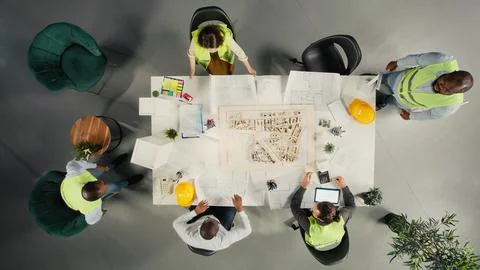 Top down view of development team consulting on real estate investment Stock Photos