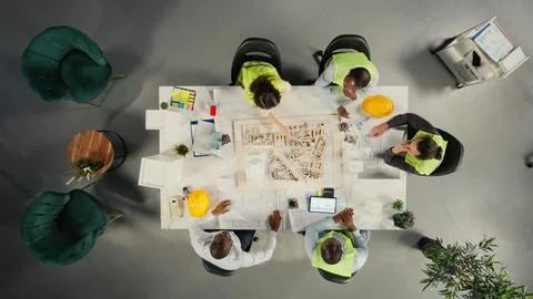 Top down view of development team consulting on real estate investment Stock Photos