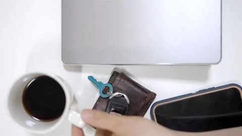 Top down view of a digital nomad remote work setup with laptop, coffee Stock Footage 336474187