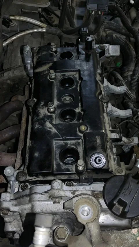 Top-down view of a dirty car engine valve cover Stock Footage 332240068