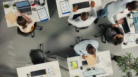 Top down view of diverse work team study analytics and forecasting Stock Photos