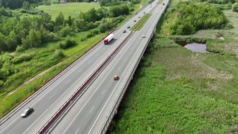 Top down view from a drone of cars driving down the street, Amber Highway, .. Stock Footage 311055036