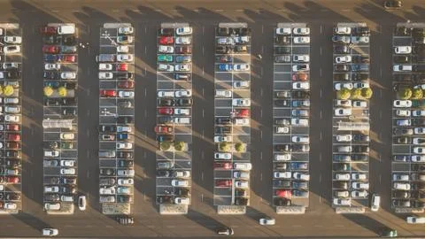 Top down view from drone on mall parking with many cars. Stock Photos