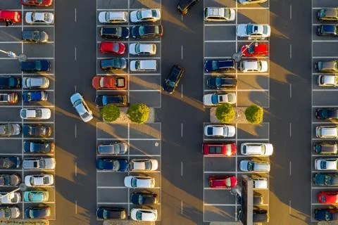Top down view from drone on mall parking with many cars. Stock Photos