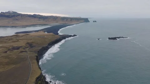 Top-Down View of Dyrholaey’s Black Sand Beaches and Crashing Waves Stock Footage 294385954