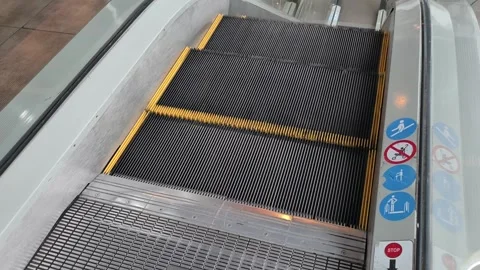 Top-down view of an empty escalator moving downwards in a building. Stock Footage 318022646