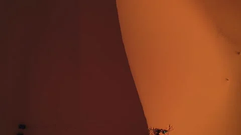 Top-down view of Erg Chebbi sand dune ridge with dramatic sunrise shadow Stock Footage 339045225