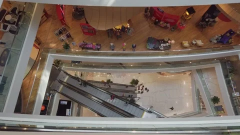 Top down view to escalators in department store with many people shopping Stock Footage 201547311