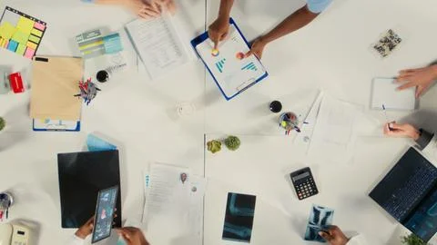 Top down view of experts group reviewing clinical data Stock Photos