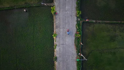 Top Down View of Farmer and Motorbikes on Rural Vietnam Road Stock Footage 336610435
