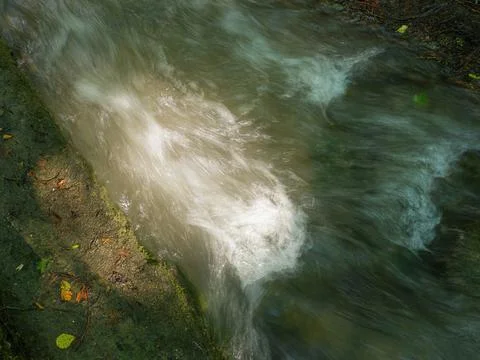 Top-Down View of a Fast Flowing Stream with Silky Long Exposure Water Фото