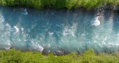Top down view of fast moving mountain river. Nature of Canada Stock Footage 343447545
