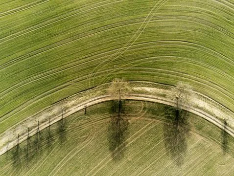 Top down view on field with tractor tracks Stock Photos