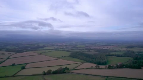 Top Down View of Fields and Meadows over English Village, Berry Pomeroy, Devon Stock Footage 162007942