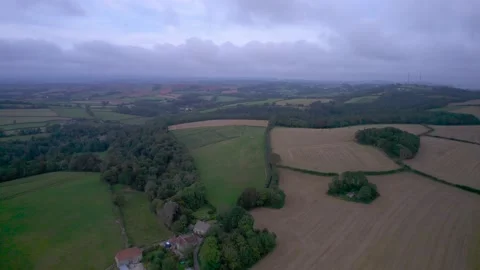 Top Down View of Fields and Meadows over English Village, Berry Pomeroy, Devon Video stock 162009456