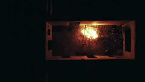 Top down view of fire burning in a house under construction at night Stockbeeldmateriaal 334380766