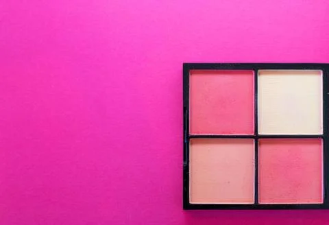 Top down view flat lay of a make up box on a pink background. Copyspace on th Stock Photos