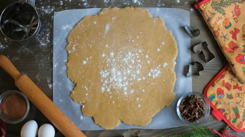 Top-down view, flour falling on traditional Christmas cookies. Stock Footage 165438238